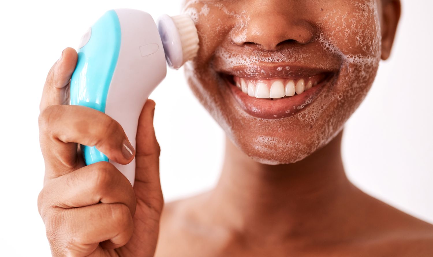 woman cleansing her face
